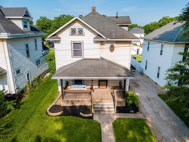 559 Pearl St, Marion, OH 43302 - back of property with covered porch, roof with shingles, and a lawn