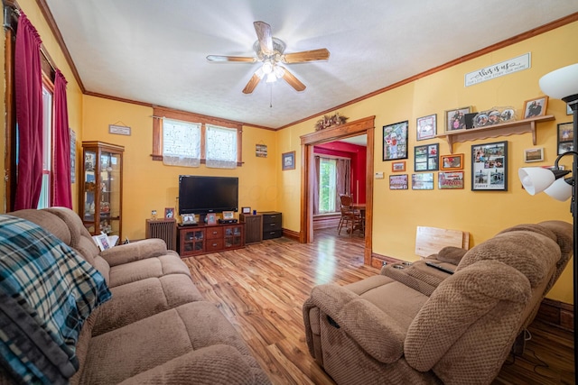 559 Pearl St, Marion, OH 43302 - living room featuring a ceiling fan, ornamental molding, and wood finished floors
