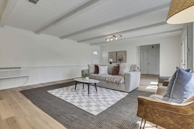 1080 Coonpath Rd NW, Lancaster, OH 43130 - living area featuring wood finished floors, beamed ceiling, and wainscoting