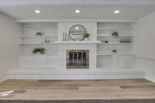 1080 Coonpath Rd NW, Lancaster, OH 43130 - unfurnished living room featuring wood finished floors, a fireplace, recessed lighting, and wooden walls