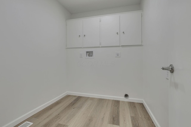 1080 Coonpath Rd NW, Lancaster, OH 43130 - washroom with cabinet space, hookup for an electric dryer, washer hookup, and light wood finished floors