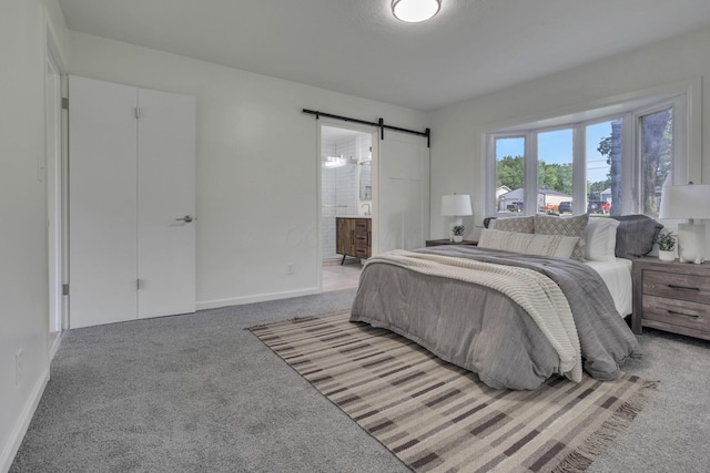 1080 Coonpath Rd NW, Lancaster, OH 43130 - bedroom with a barn door, light colored carpet, and ensuite bath