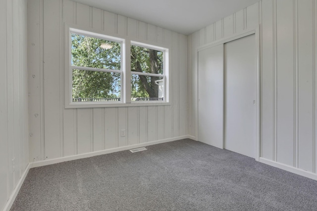 1080 Coonpath Rd NW, Lancaster, OH 43130 - unfurnished bedroom with carpet, multiple windows, and a closet