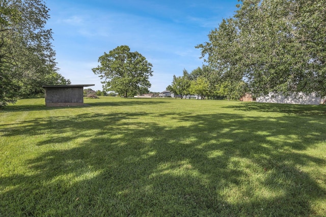1080 Coonpath Rd NW, Lancaster, OH 43130 - view of grassy yard with a storage shed