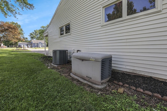 1080 Coonpath Rd NW, Lancaster, OH 43130 - view of property exterior featuring a cooling unit and a yard