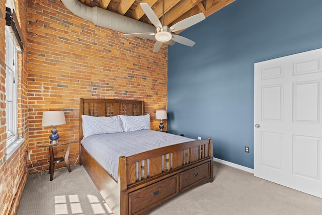 51 W Blenkner St Unit 306, Columbus, OH 43215 - bedroom with brick wall, light colored carpet, and ceiling fan