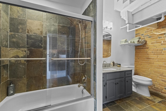 51 W Blenkner St Unit 306, Columbus, OH 43215 - full bath featuring shower / bath combination with glass door, vanity, and brick wall