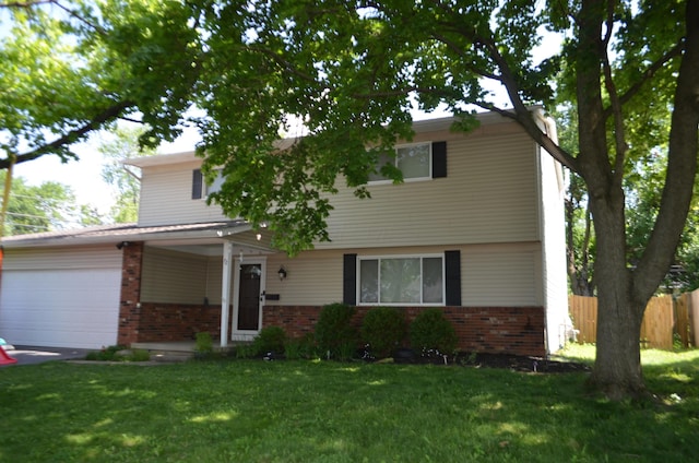 72 Rockwell Way, Worthington, OH 43085 - view of front of house featuring brick siding, a garage, and driveway