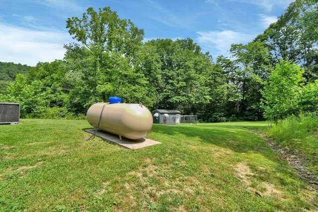 4619 Spring Hill Rd, Heath, OH 43056 - view of green lawn featuring a wooded view and an outdoor structure