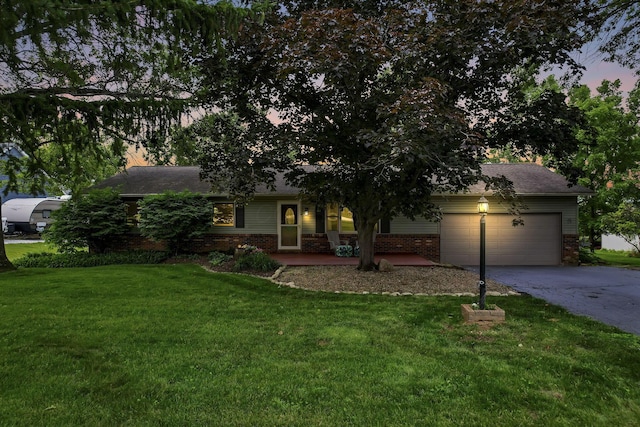 748 Forward Pass Rd SW, Pataskala, OH 43062 - view of front of house featuring brick siding, driveway, and a lawn