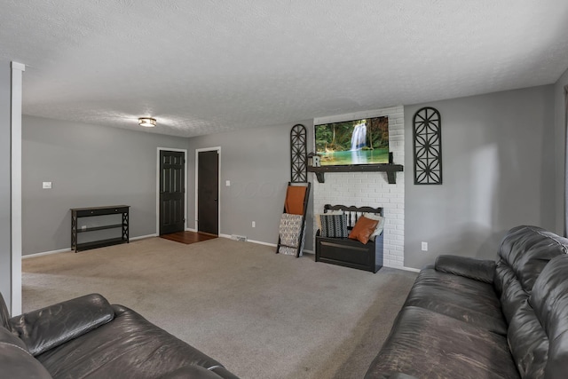 748 Forward Pass Rd SW, Pataskala, OH 43062 - living room featuring carpet flooring, a textured ceiling, and a brick fireplace
