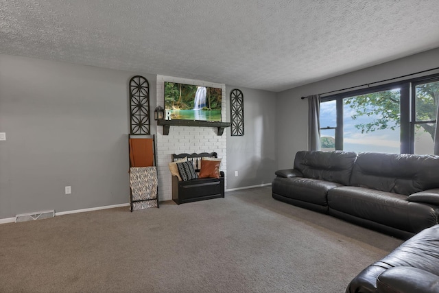 748 Forward Pass Rd SW, Pataskala, OH 43062 - living room featuring carpet floors, a textured ceiling, and a fireplace