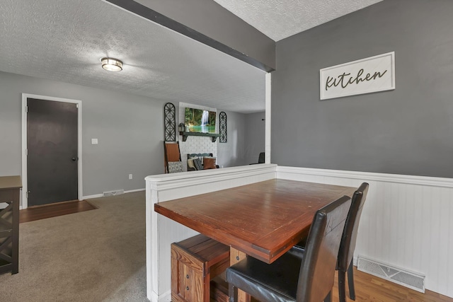 748 Forward Pass Rd SW, Pataskala, OH 43062 - dining space with a textured ceiling and wainscoting