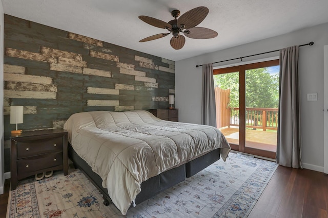 748 Forward Pass Rd SW, Pataskala, OH 43062 - bedroom featuring access to outside, wood finished floors, ceiling fan, and an accent wall