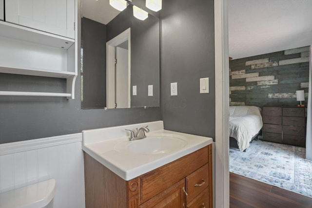 748 Forward Pass Rd SW, Pataskala, OH 43062 - bathroom featuring vanity, wood finished floors, wainscoting, and a ceiling fan