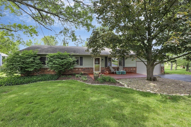748 Forward Pass Rd SW, Pataskala, OH 43062 - ranch-style home with brick siding, driveway, a front yard, and a garage