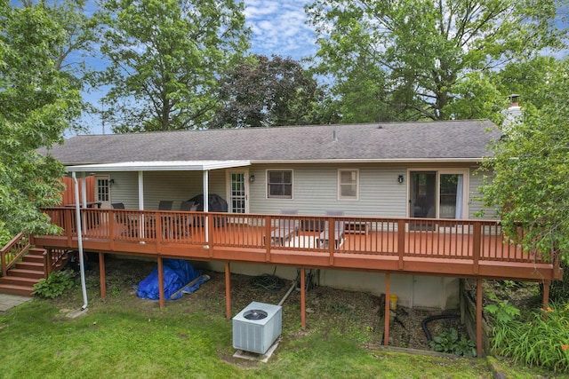 748 Forward Pass Rd SW, Pataskala, OH 43062 - rear view of property with a lawn, a shingled roof, a chimney, and a wooden deck