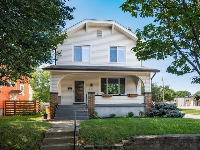 211 E Jenkins Ave, Columbus, OH 43207 - view of front facade with a porch and a front lawn
