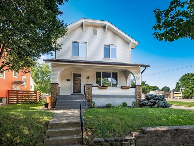 211 E Jenkins Ave, Columbus, OH 43207 - view of front of home featuring a porch and a front yard