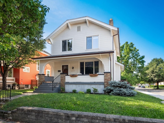 211 E Jenkins Ave, Columbus, OH 43207 - view of front of property featuring a chimney, a front lawn, and a porch