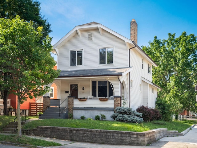 211 E Jenkins Ave, Columbus, OH 43207 - view of front of home featuring a chimney and a porch