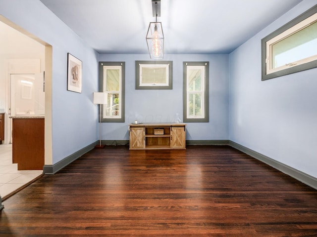 211 E Jenkins Ave, Columbus, OH 43207 - unfurnished dining area featuring healthy amount of natural light and dark wood-style floors