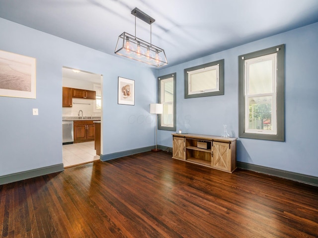 211 E Jenkins Ave, Columbus, OH 43207 - spare room featuring a sink and wood finished floors