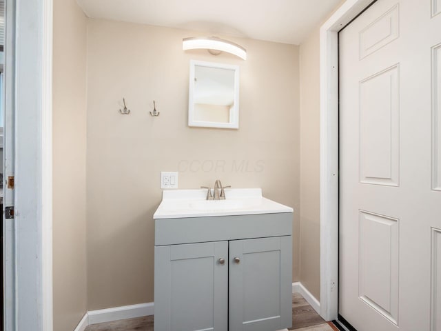 211 E Jenkins Ave, Columbus, OH 43207 - bathroom with vanity and wood finished floors