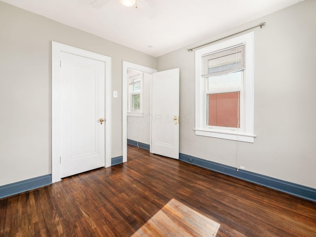 211 E Jenkins Ave, Columbus, OH 43207 - unfurnished bedroom featuring dark wood-type flooring and a ceiling fan