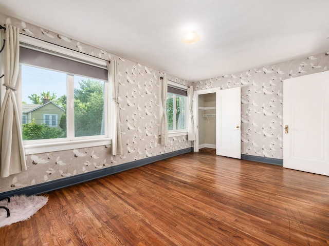 211 E Jenkins Ave, Columbus, OH 43207 - unfurnished bedroom featuring wood finished floors and a closet