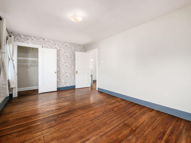 211 E Jenkins Ave, Columbus, OH 43207 - unfurnished bedroom featuring wood finished floors and a closet