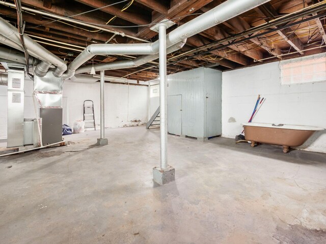 211 E Jenkins Ave, Columbus, OH 43207 - unfinished basement with heating unit and stairs