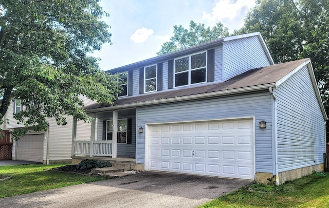 417 Hannifin Dr, Blacklick, OH 43004 - traditional home with a porch, asphalt driveway, and an attached garage