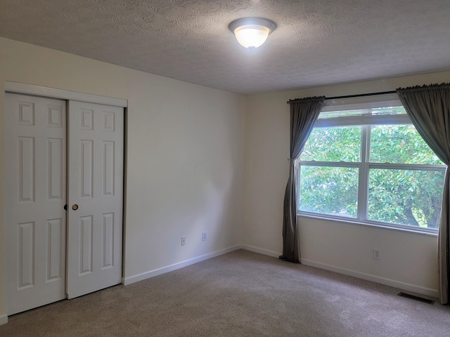 417 Hannifin Dr, Blacklick, OH 43004 - unfurnished bedroom with carpet, a textured ceiling, and a closet