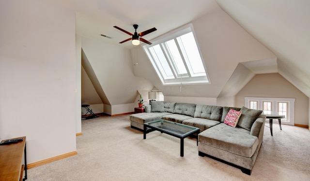 1447 Fair Ave, Columbus, OH 43205 - living area with lofted ceiling, carpet, a ceiling fan, and a skylight