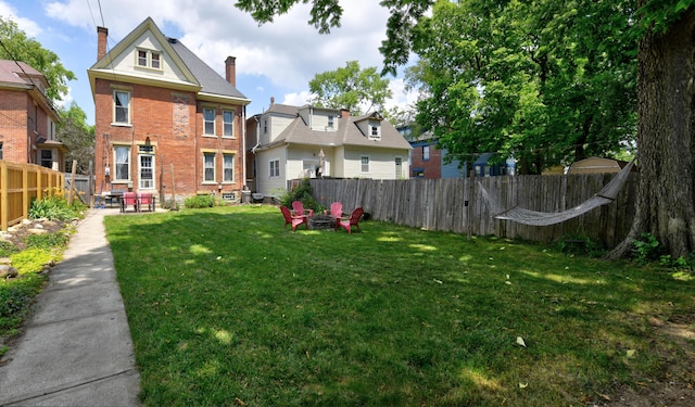 1447 Fair Ave, Columbus, OH 43205 - fenced backyard featuring an outdoor fire pit and a patio