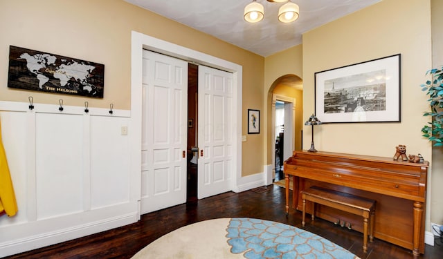1447 Fair Ave, Columbus, OH 43205 - entrance foyer with arched walkways, a chandelier, and wood finished floors