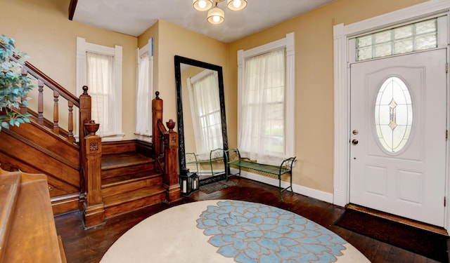 1447 Fair Ave, Columbus, OH 43205 - foyer entrance featuring dark wood-type flooring, stairs, and plenty of natural light
