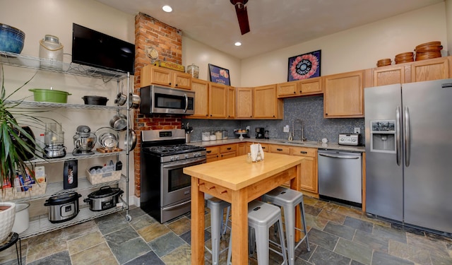 1447 Fair Ave, Columbus, OH 43205 - kitchen featuring stainless steel appliances, stone finish floors, decorative backsplash, recessed lighting, and light brown cabinets