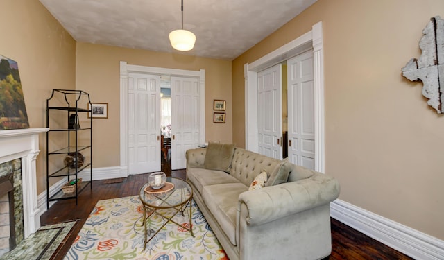 1447 Fair Ave, Columbus, OH 43205 - living room featuring dark wood-style flooring and a fireplace