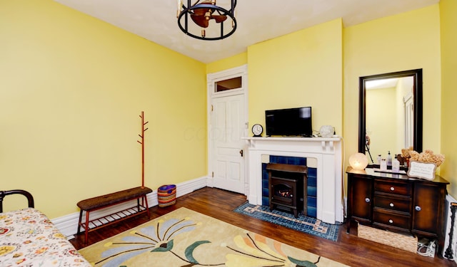 1447 Fair Ave, Columbus, OH 43205 - living area featuring a chandelier, wood finished floors, and a wood stove