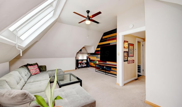 1447 Fair Ave, Columbus, OH 43205 - living room featuring vaulted ceiling, carpet floors, ceiling fan, and a skylight