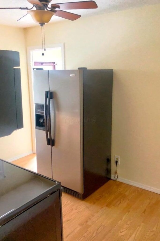 2580 Audubon Rd, Columbus, OH 43211 - kitchen featuring stainless steel refrigerator with ice dispenser, a ceiling fan, light wood-type flooring, and black electric range oven