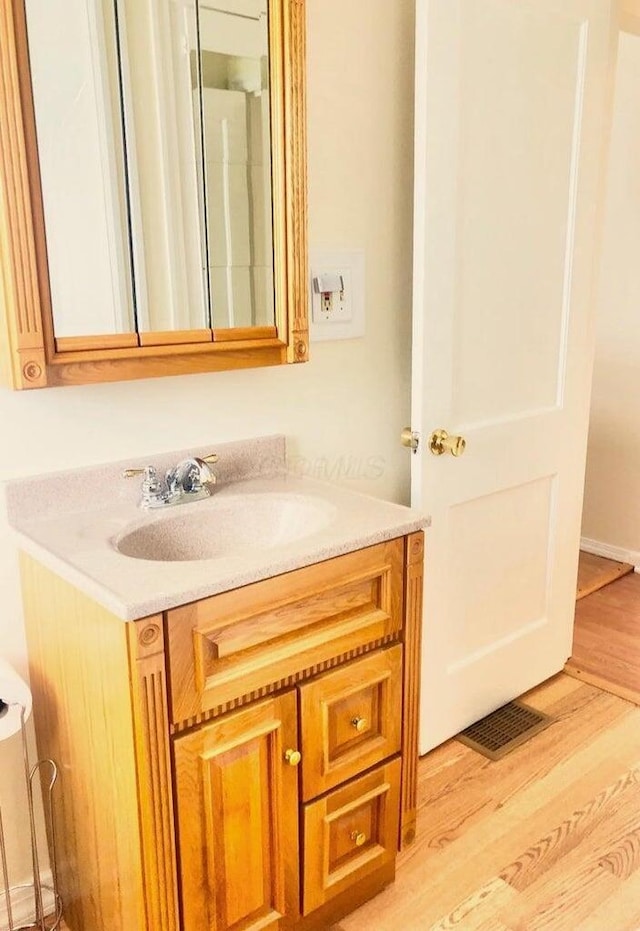 2580 Audubon Rd, Columbus, OH 43211 - bathroom featuring vanity and wood finished floors