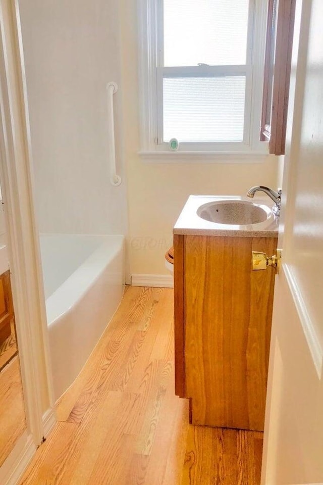 2580 Audubon Rd, Columbus, OH 43211 - full bath with wood finished floors and vanity