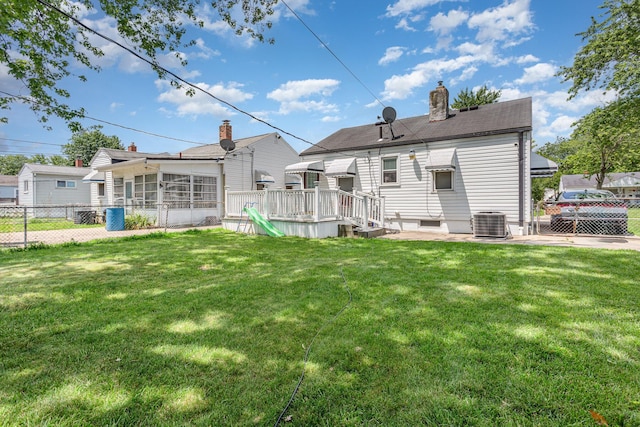 2580 Audubon Rd, Columbus, OH 43211 - back of house with a chimney, a sunroom, and a deck