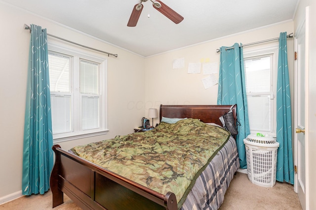2580 Audubon Rd, Columbus, OH 43211 - bedroom featuring carpet flooring, multiple windows, ornamental molding, and a ceiling fan