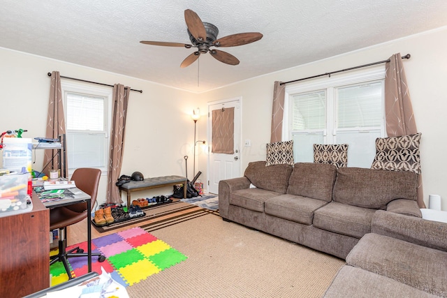 2580 Audubon Rd, Columbus, OH 43211 - living room with ceiling fan and a textured ceiling