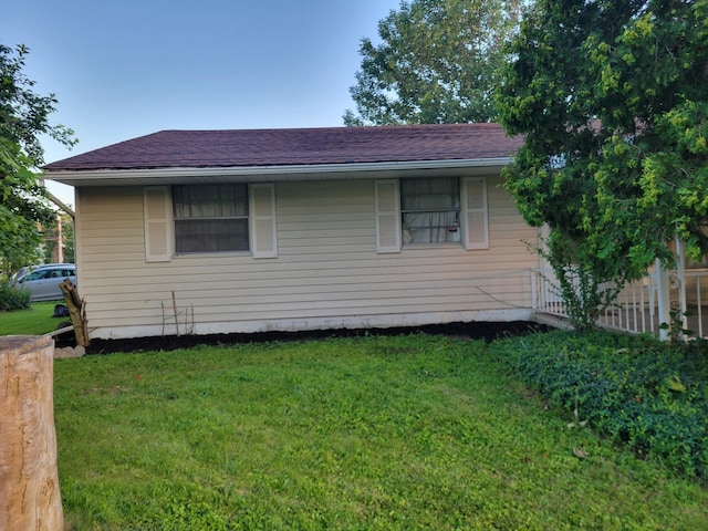 327 Ziegler Ave, Columbus, OH 43207 - view of property exterior featuring a lawn and roof with shingles