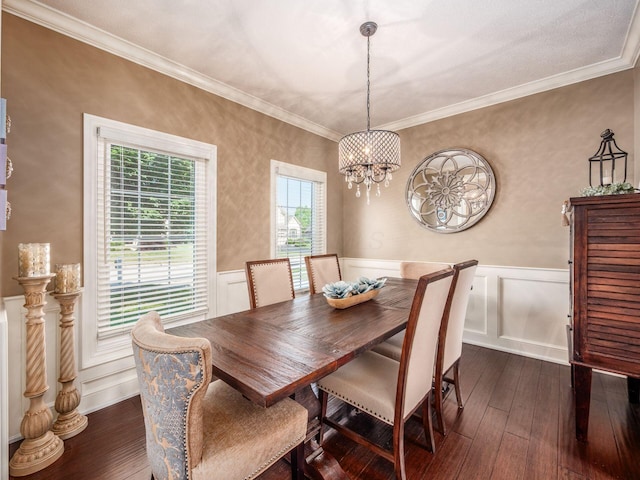 7635 Overland Trl, Delaware, OH 43015 - dining space with dark wood finished floors, a chandelier, wainscoting, ornamental molding, and a decorative wall